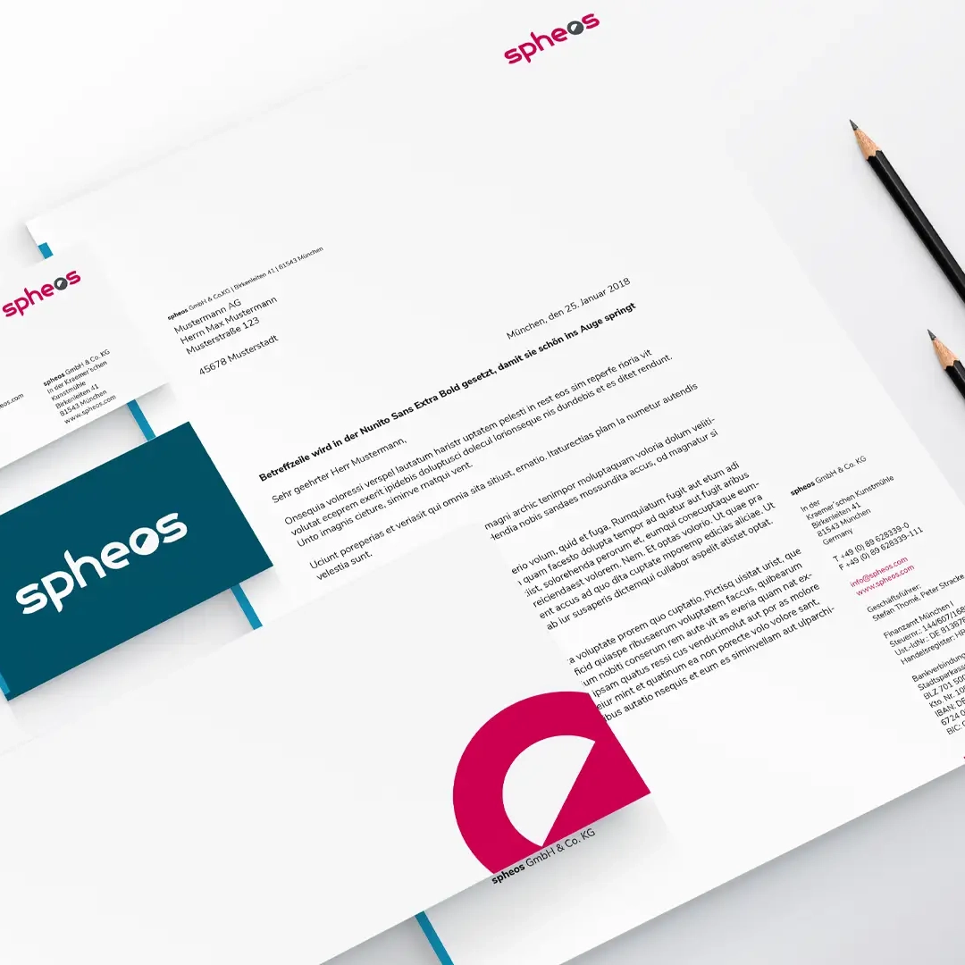 Close-up of a printed design guide titled “spheos BASIC DESIGN GUIDE,” developed by a corporate design agency to ensure a consistent brand identity. The cover combines red, white, and blue color accents with clear, striking typography and reflects the strategic design of a well-thought-out corporate identity. Design guides like this one are essential for consistent visual brand communication and professional branding.